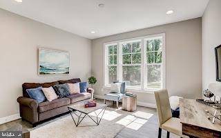 4712 Carroll Manor Rd, Baldwin, MD 21013 - living room featuring baseboards, recessed lighting, and wood finished floors