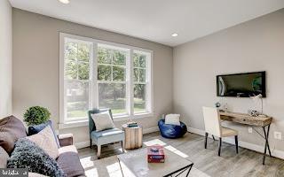 living room with light hardwood / wood-style floors