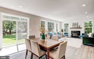 4712 Carroll Manor Rd, Baldwin, MD 21013 - dining space with wood finished floors, a fireplace, and recessed lighting