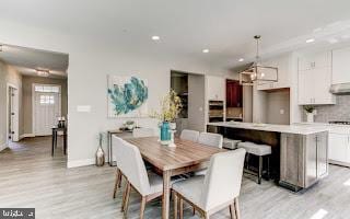 dining area with light hardwood / wood-style flooring