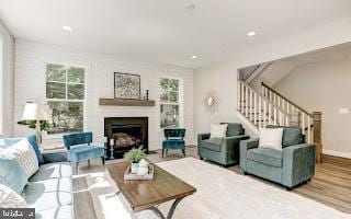4712 Carroll Manor Rd, Baldwin, MD 21013 - living room featuring plenty of natural light, stairway, a fireplace, wood finished floors, and recessed lighting