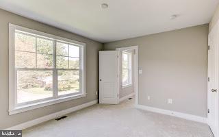 4712 Carroll Manor Rd, Baldwin, MD 21013 - unfurnished bedroom featuring carpet flooring and baseboards