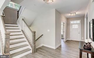 entryway with light hardwood / wood-style flooring