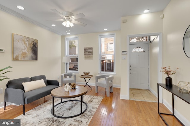 foyer featuring ceiling fan and light hardwood / wood-style flooring