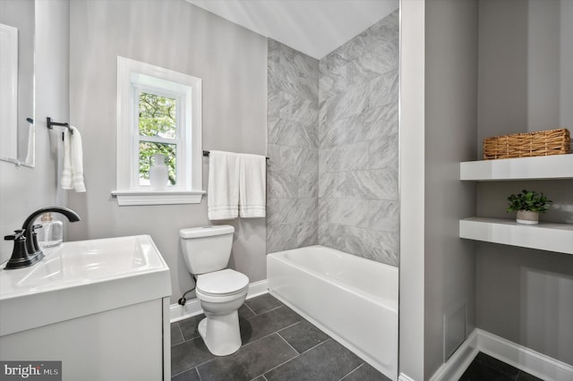 bathroom featuring vanity, toilet, and tile floors