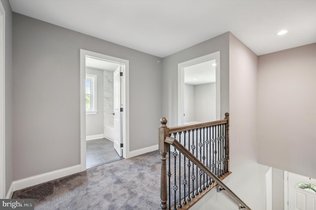 hallway featuring carpet