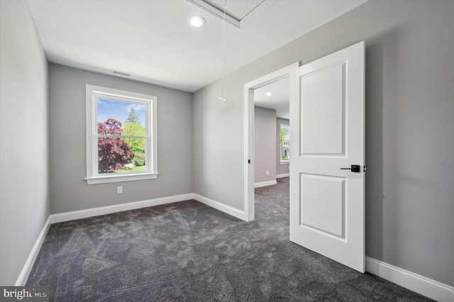 unfurnished room with carpet floors