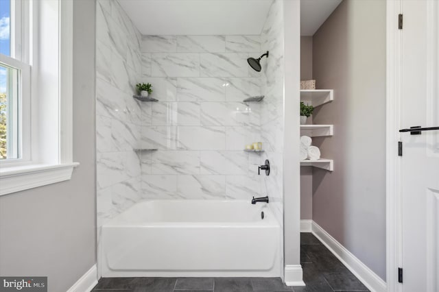 bathroom with tiled shower / bath and tile floors