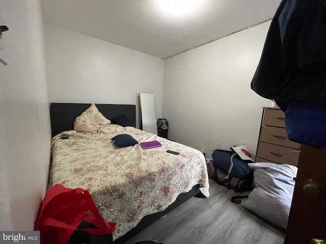 bedroom with wood-type flooring