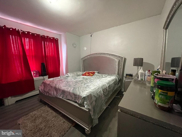 bedroom featuring dark hardwood / wood-style floors