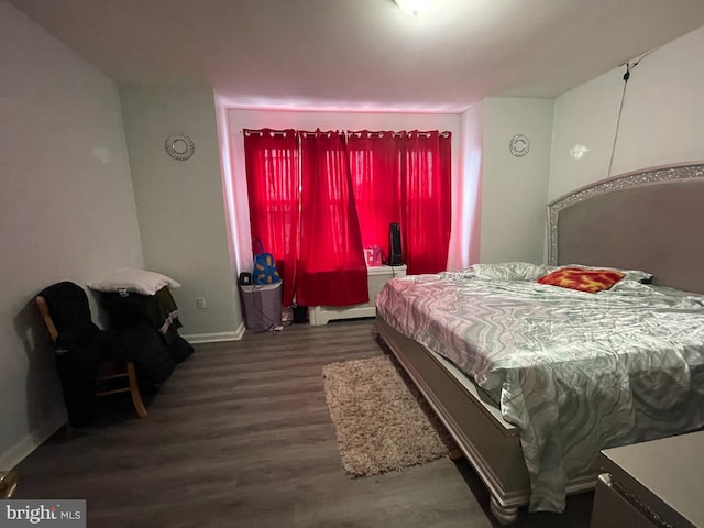 bedroom featuring dark wood-type flooring