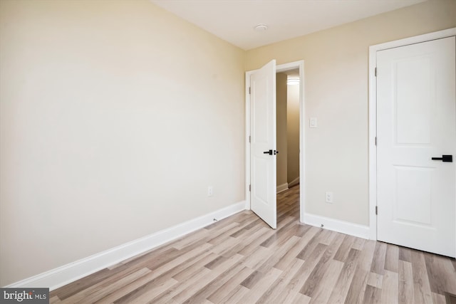 unfurnished bedroom with light hardwood / wood-style floors