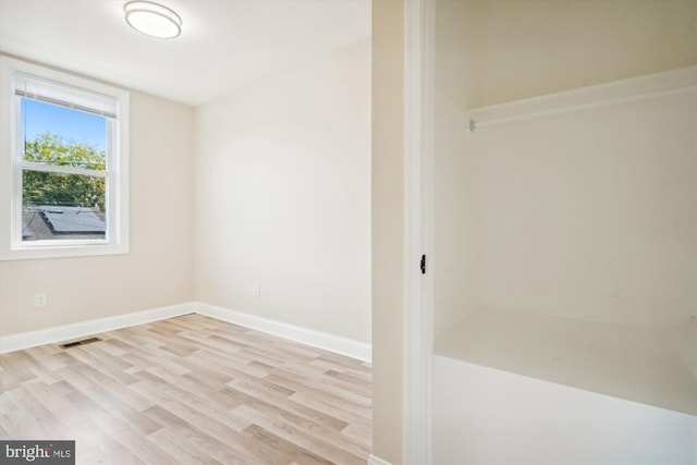 unfurnished room featuring light hardwood / wood-style floors