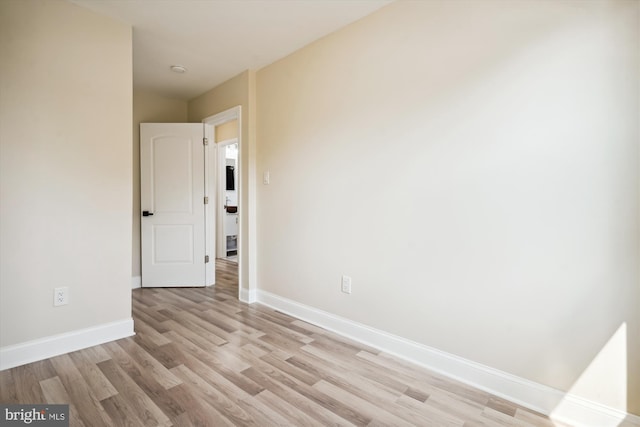 spare room with light wood-type flooring