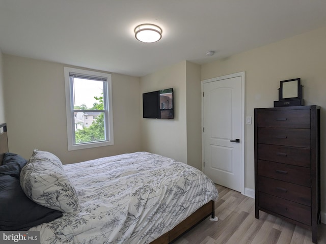 bedroom with light hardwood / wood-style floors