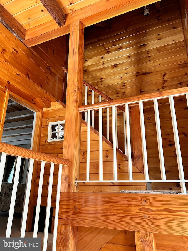 staircase with wooden walls