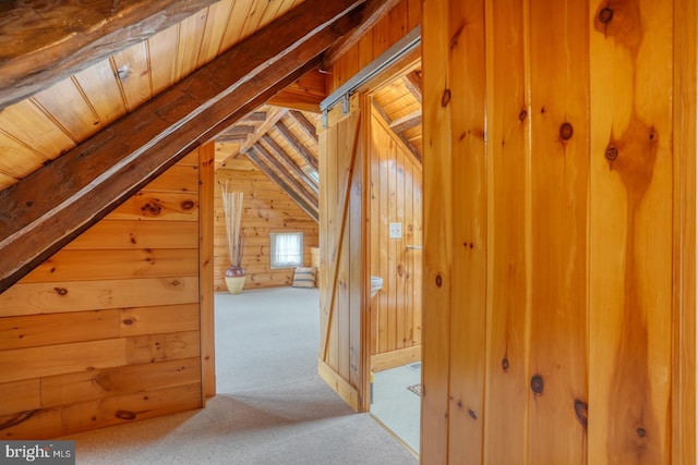 bonus room featuring carpet floors, wood ceiling, wooden walls, and vaulted ceiling