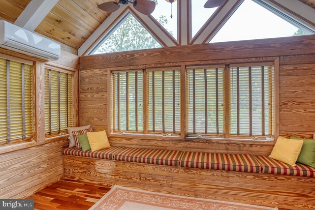 sitting room with a ceiling fan, wood ceiling, wood finished floors, a wall mounted air conditioner, and high vaulted ceiling