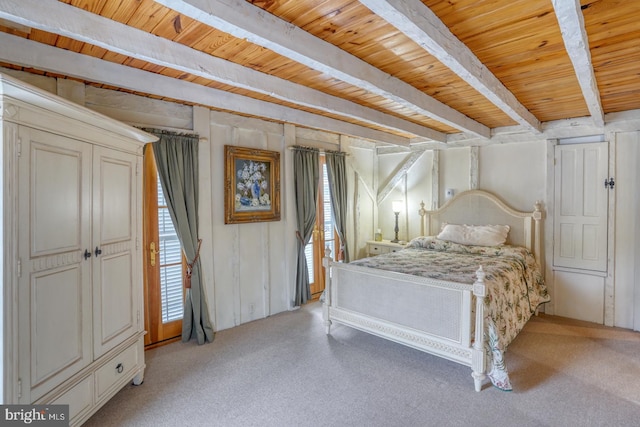 bedroom featuring wood ceiling, beamed ceiling, and light colored carpet