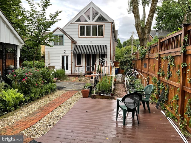 back of property with a fenced backyard