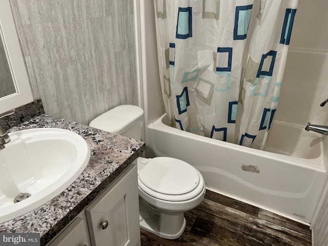 full bathroom featuring hardwood / wood-style floors, shower / bath combination with curtain, toilet, and large vanity