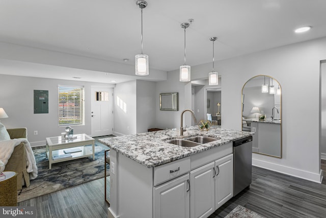 kitchen with sink, dishwasher, decorative light fixtures, dark hardwood / wood-style floors, and a center island with sink