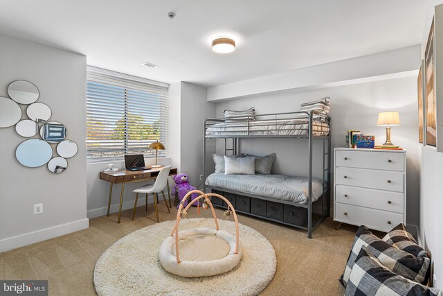 bedroom with light carpet