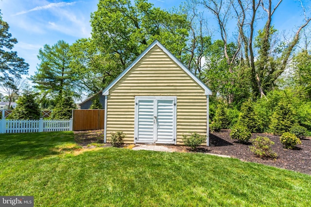 view of outdoor structure with a lawn