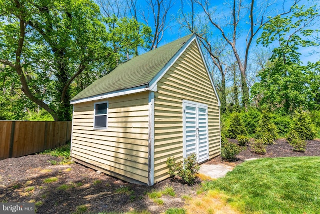 view of outdoor structure with a lawn