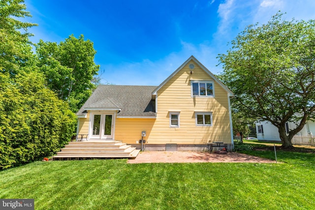 back of house featuring a patio area and a yard