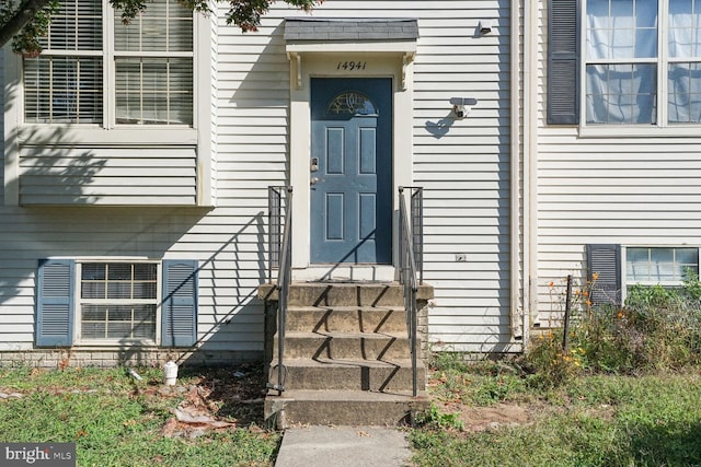 view of exterior entry featuring central AC