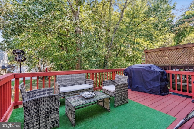 wooden terrace with a grill