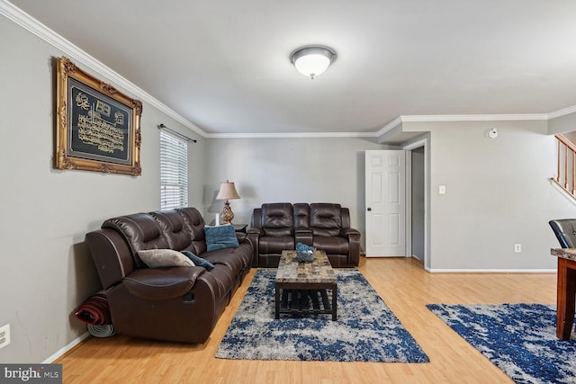 living room with ornamental molding and hardwood / wood-style floors