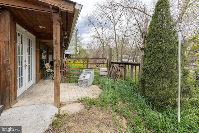 view of yard with french doors