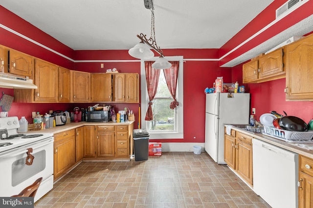 kitchen featuring decorative light fixtures and white appliances