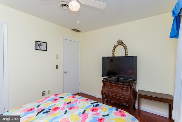 bedroom featuring ceiling fan and dark hardwood / wood-style flooring