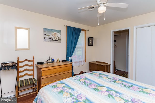 bedroom featuring wood-type flooring, a closet, and ceiling fan