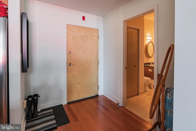 hallway with light wood-type flooring