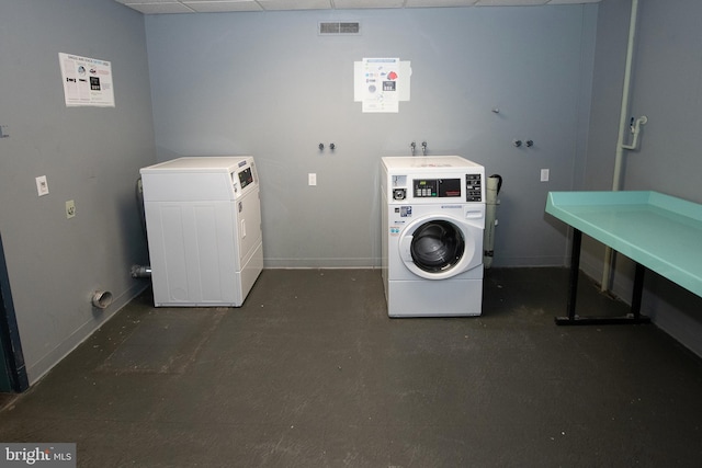 laundry area with independent washer and dryer