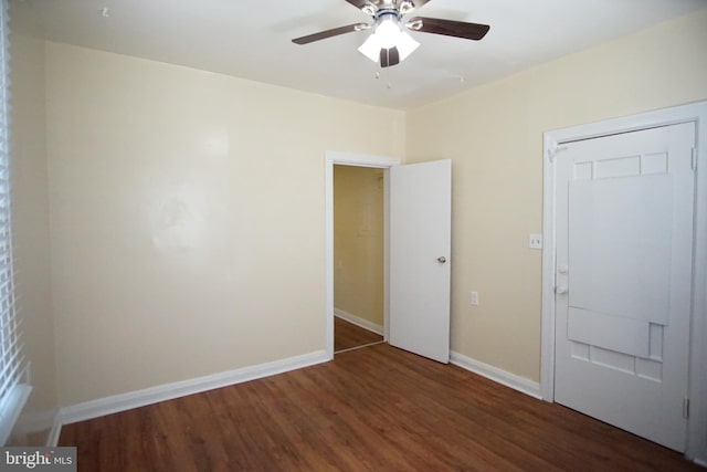 unfurnished bedroom with a closet, ceiling fan, and dark wood-type flooring