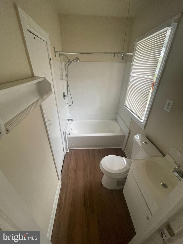 full bathroom featuring wood-type flooring, vanity, toilet, and shower / washtub combination