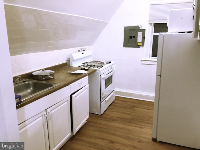 kitchen featuring white appliances, white cabinetry, sink, vaulted ceiling, and hardwood / wood-style flooring