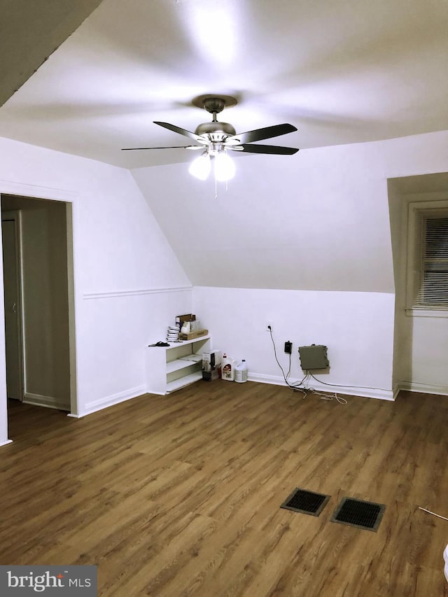 bonus room with dark hardwood / wood-style flooring, ceiling fan, and vaulted ceiling