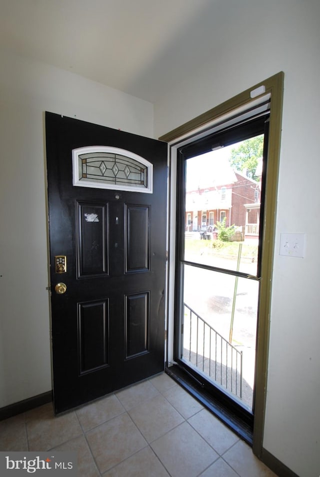 entryway featuring light tile patterned floors