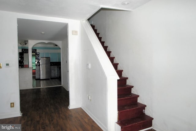 stairs with wood-type flooring