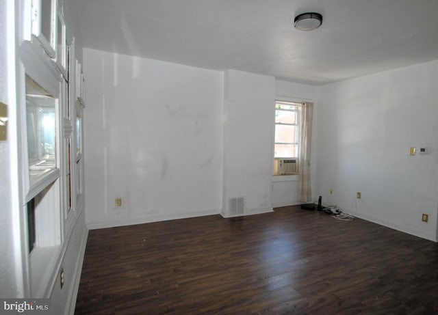 empty room featuring dark hardwood / wood-style floors