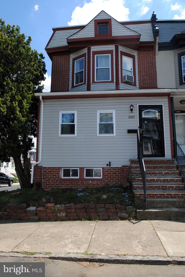 view of front of home with cooling unit