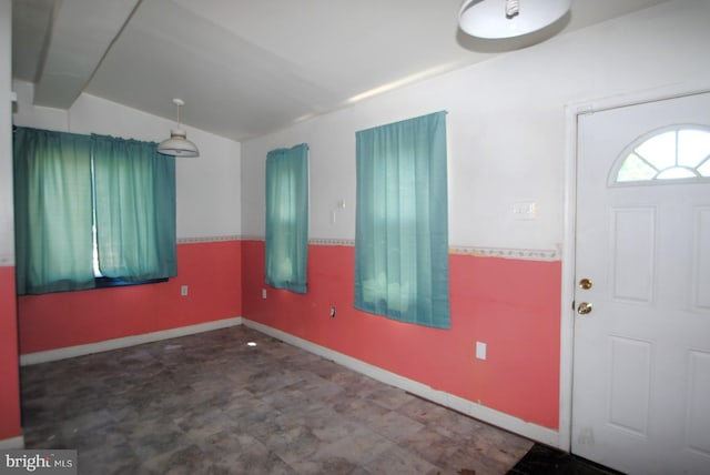 foyer entrance featuring lofted ceiling