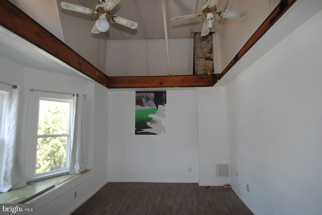 empty room with dark hardwood / wood-style floors and ceiling fan