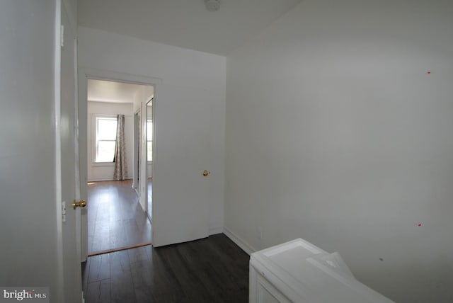 corridor with dark hardwood / wood-style floors